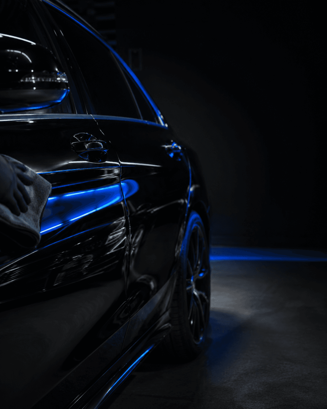 Premium detailing studio interior with finished vehicle